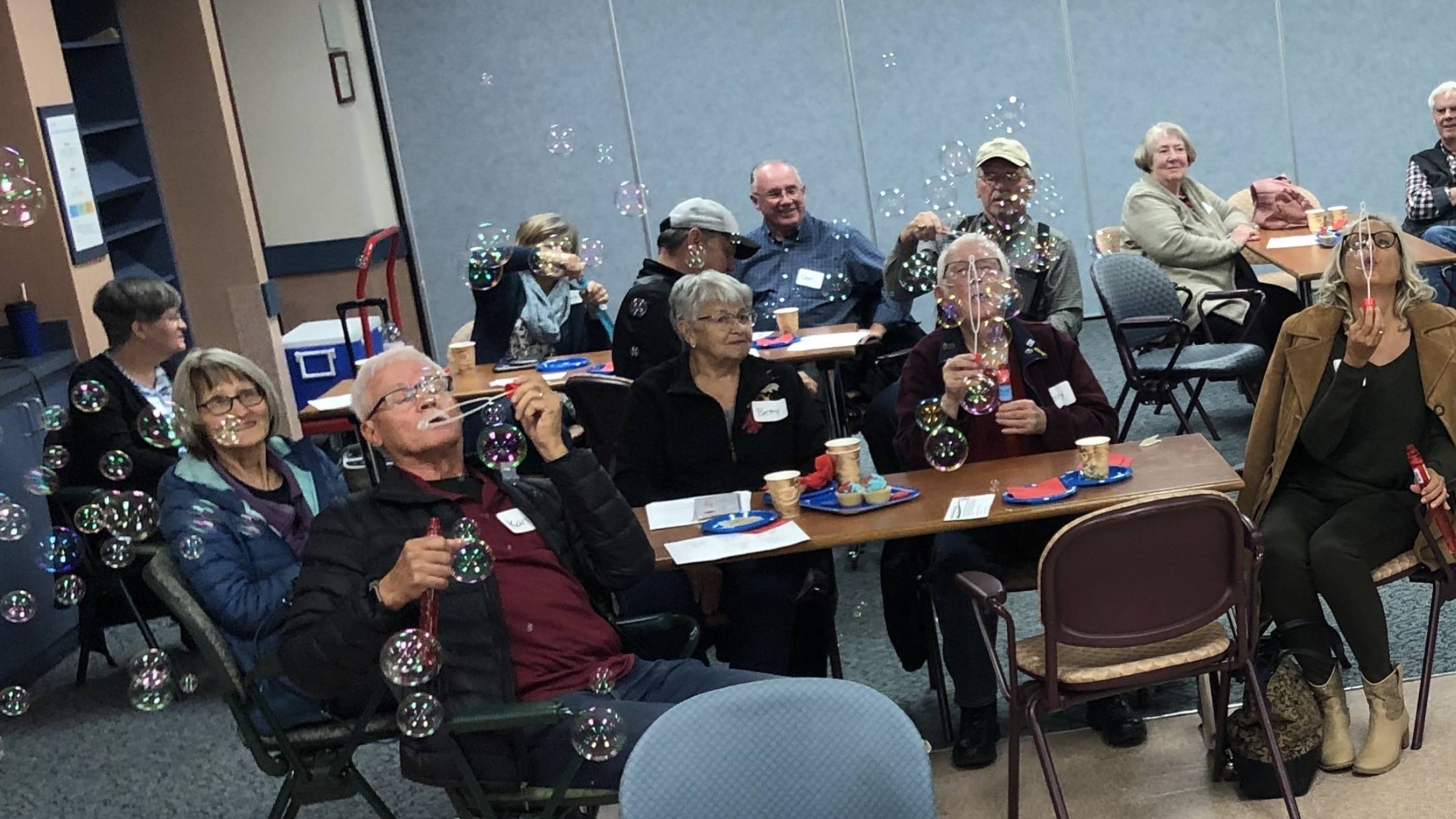 Past pictures of our support group blowing bubble together for PF. Laughter and friendship at our Christmas luncheon.