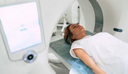 Young woman performing CT scan