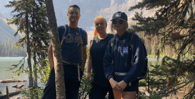 Abbie Clarke and her parents hiking in the mountain