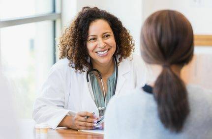 Female doctor consulting with patient