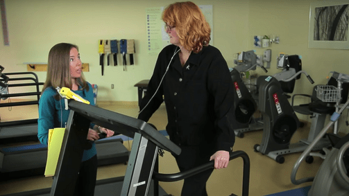 Woman on treadmill in rehab