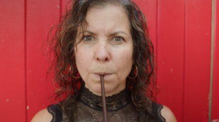 Lady breathing through straw