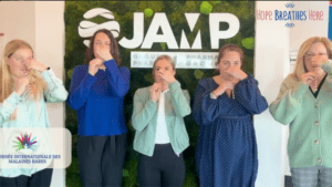 Five people block their noses while breathing through straws.