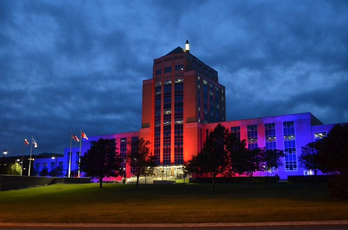 Confederation Building of St John's lit up in Red & Blue for pulmonary fibrosis