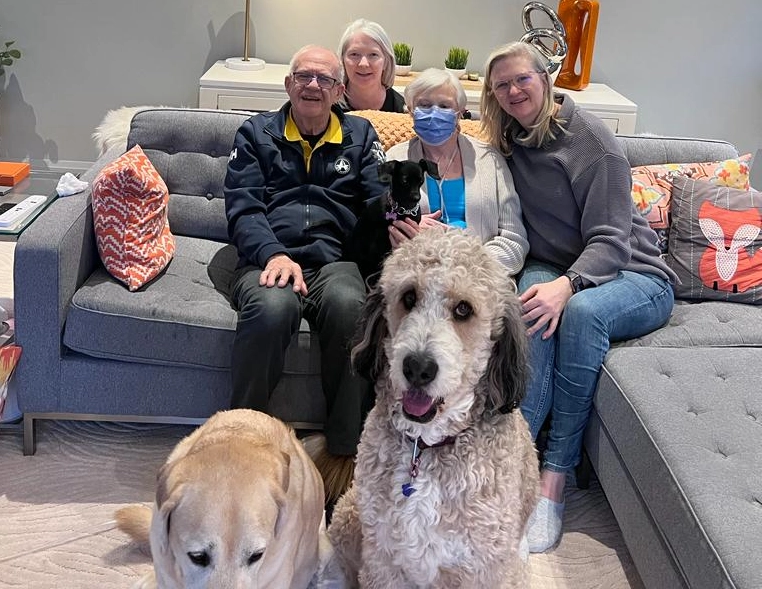 Just weeks before Anne’s transplant in 2023 the family gathered for this photo. From left to right: Brian, Lorraine, Anne (with dog Lilly on her lap) and Suzanne. Camera-shy dog on left is Bear and Suzanne’s dog Sam is front-right. (Unfortunately, dogs Bear and Sam have since passed away.)